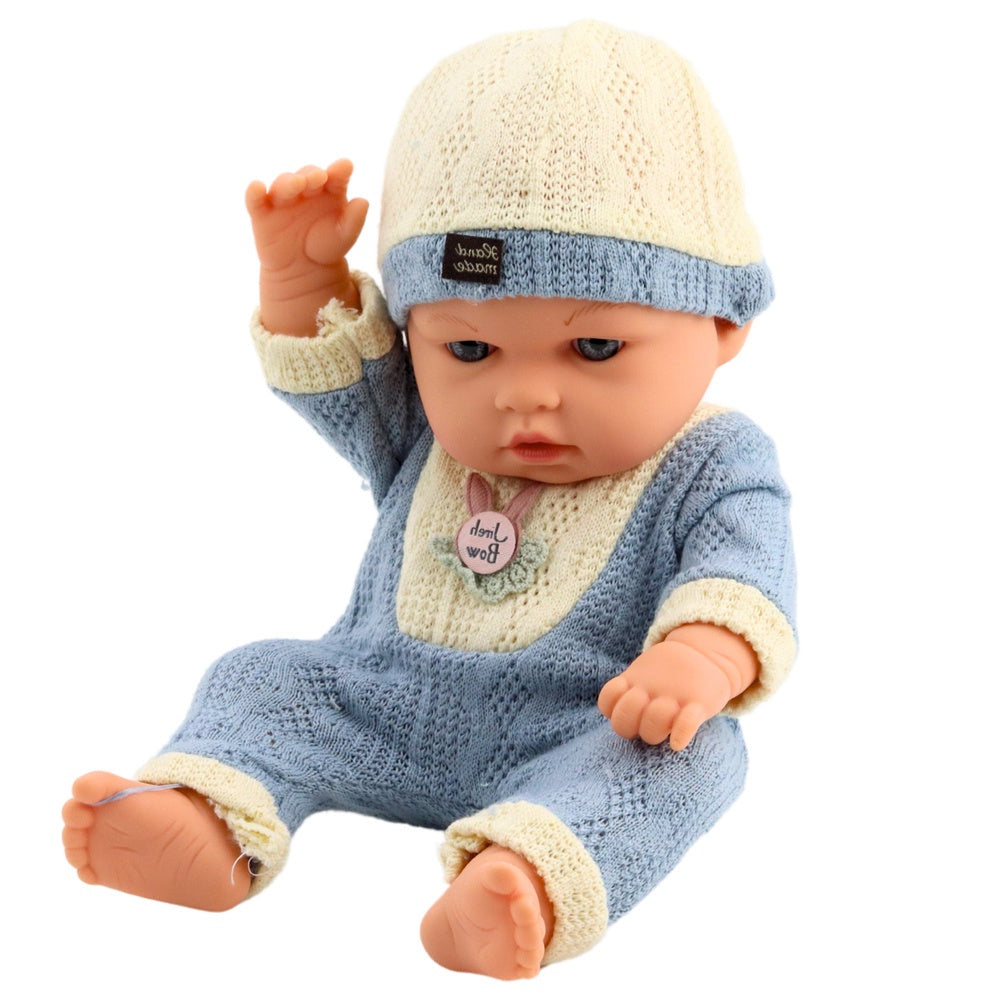 Babydocka 29 cm med stickad outfit och mössa, verklighetstrogen
