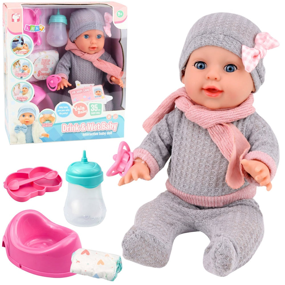 Interaktiv babydocka 35 cm med kissfunktion, potta, napp och flaska
