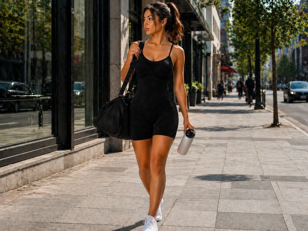 Träningsjumpsuit dam push-up med inbyggda kupor svart S/M