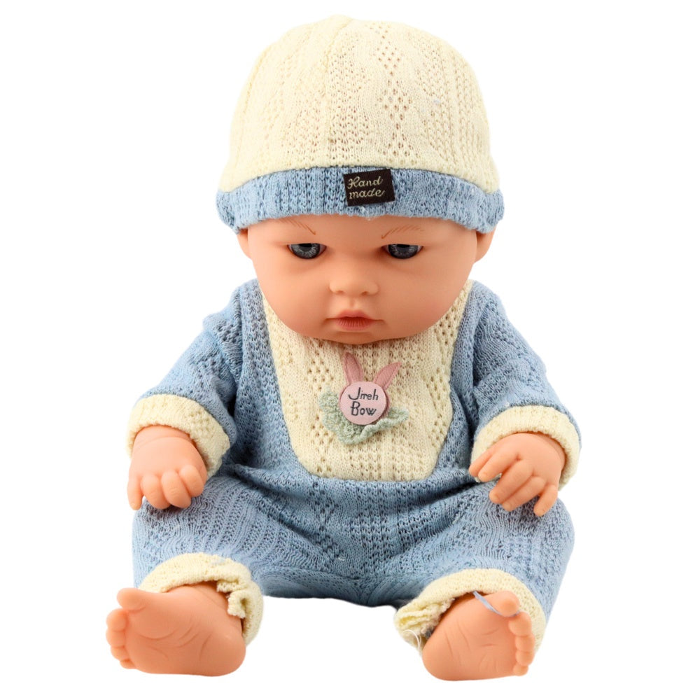 Babydocka 29 cm med stickad outfit och mössa, verklighetstrogen