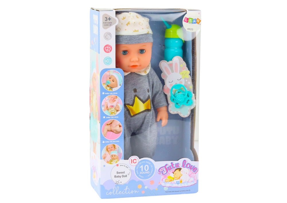 Babydocka 35 cm med ljud, kissfunktion och nappflaska, grå pyjamas