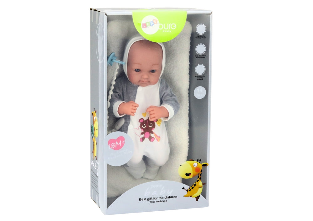 Babydocka 35 cm med rörliga armar/ben, napp på snöre och filt