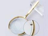 Läslupp 6x med glaslins metall guld linsdiameter 9 cm