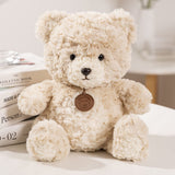 Mjukisdjur nalle beige 25 cm med medaljong